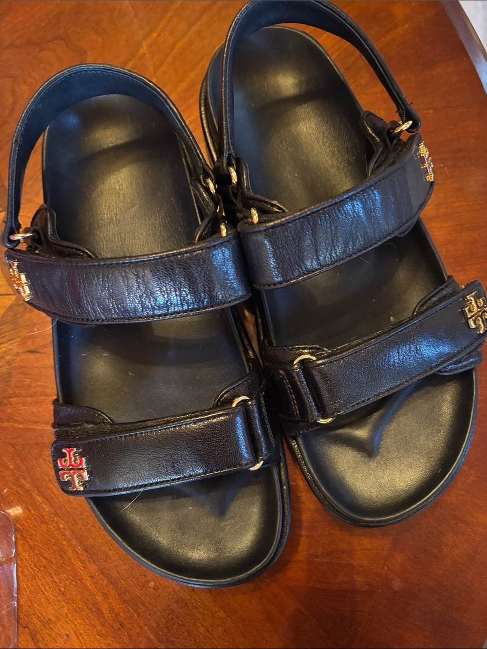 Tory Burch Kira women’s Black Leather Double-Strap Sandals with Gold Logo